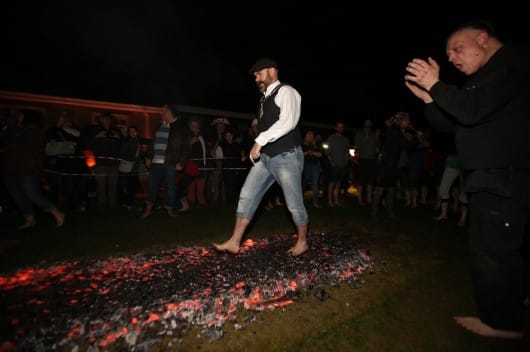 35 Brave Fundraisers Walk on Fire for South African Charity
