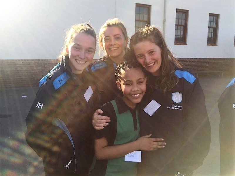 Students from Maynards School in Exeter meeting Raynick, their sponsored child