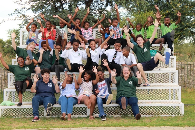The SOS Africa Charity staff and children celebrate the graduation of Kelebogile and Olebogeng