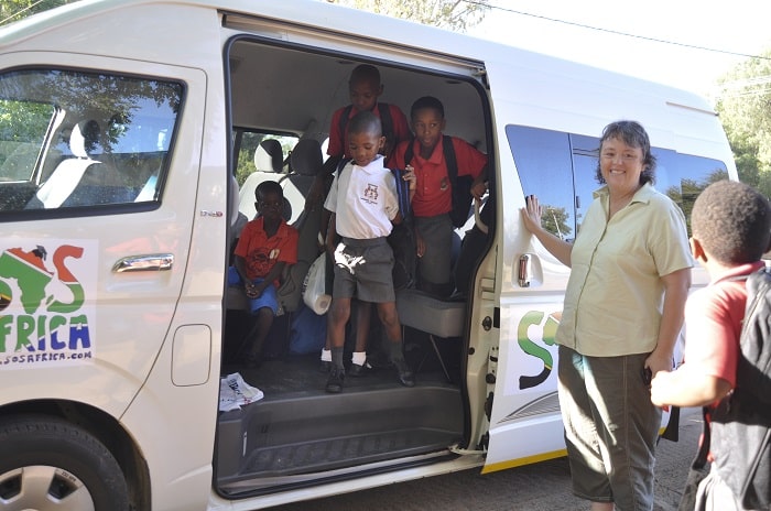The SOS Africa Charity's bus dropping children off at school