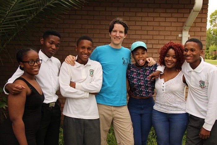 Charity Founder Matt Crowcombe with SOS Africa Mafikeng's 6 High School Graduates