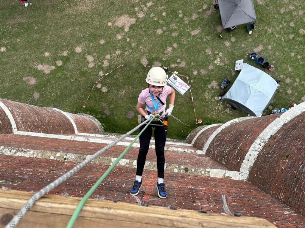 10 year-old Eris Dearsley abseiling from the top of King Alfred's Tower